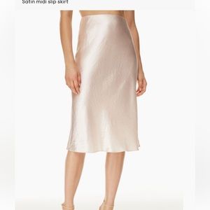 Baton Pearl Satin Midi Skirt from Aritzia